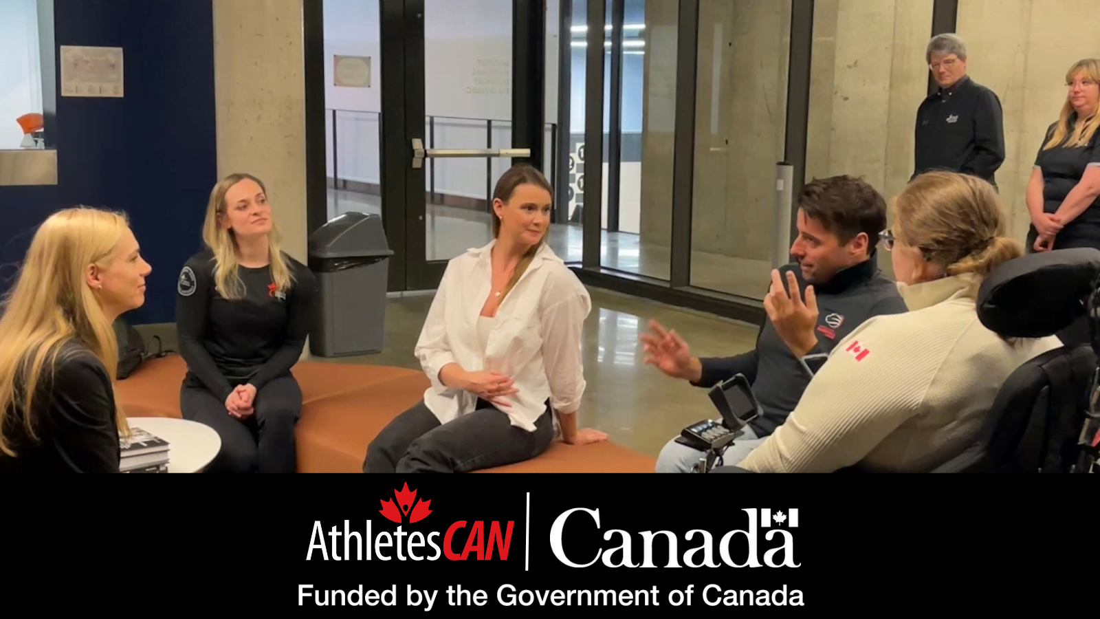 Minister of Sport Pascale St-Onge and AthletesCAN President Erin Willson speak with national team athletes. Below: AthletesCAN and Canada logos with "Funded by Government of Canada" acknowledgement underneath